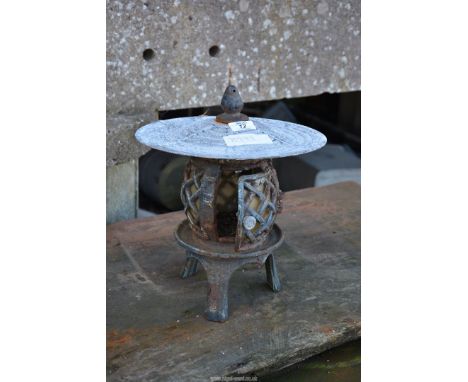 A cast iron garden Lantern.
