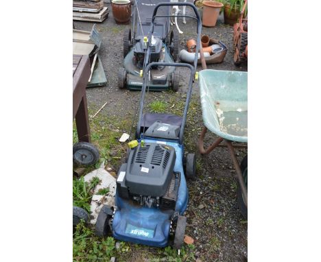 An "Extreme" 4 stroke petrol Mower, with grass box, (engine turns at time of lotting).