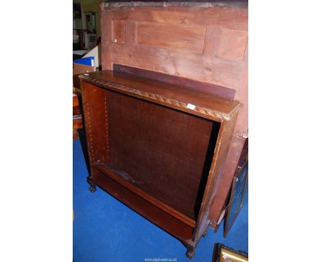 A darkwood Bookshelf with three shelves (no shelf brackets), 40" wide x 11" deep x 42" high.