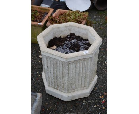 A hexagonal planter, 20" diameter x 21" tall.