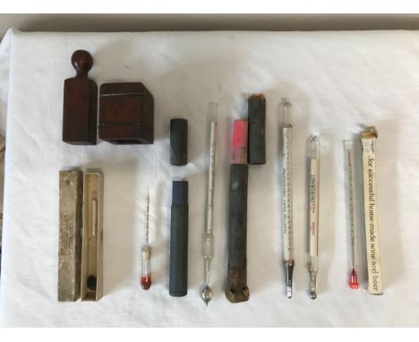 Three 19thC/20thC hydrometers together with a wooden box possibly a stamp, two floating dairy thermometers and a wine and bee