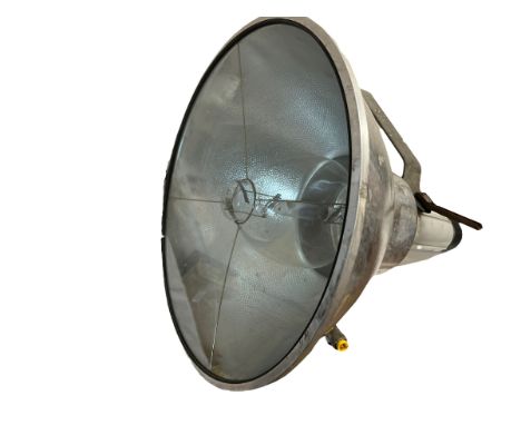 A large metal spot light/studio light on metal mounting bracket. Spot light face 48cm d, length 57cm.