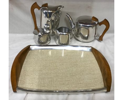 Picquot ware 5 piece tea set to include teapot, hot water pot, cream jar and sugar bowl with tray.Condition ReportMinor signs