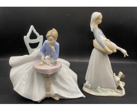 Two figurines to include Lladro Daisa and NAO figurine, playing with kitty 1355. Tallest 27cm h.Condition ReportGood conditio