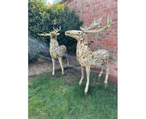 A pair of large driftwood art deer figures. 145cm h to antler x 130cm l approx.&nbsp;