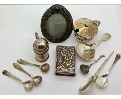 A quantity of silver to include caddy, salt and mustard spoons, mustard pot, pepper pot, oval frame etc. Various dates and ma