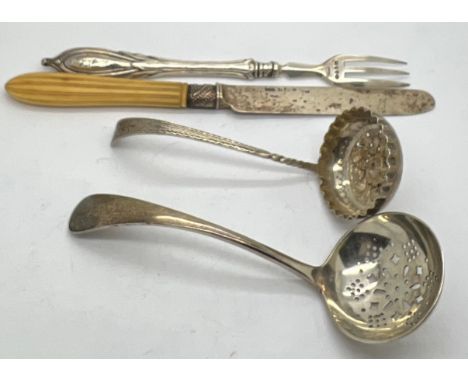 Silver to include; two sifter spoons, silver bladed knife and a fork, sifter with bright cut decoration Birmingham 1892 maker