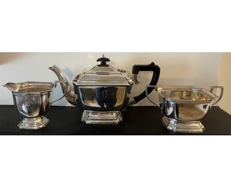 Three piece silver tea service with ebony handle and knop; Birmingham 1935 maker Elkington &amp; Co. Total weight 900gm.Condi