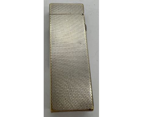 A Vintage Dunhill cigarette lighter in engine turned case marked US.RE 24163 Patented, approx 6 5cm h.Condition ReportSmall d