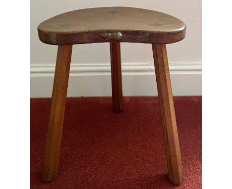 A Robert 'Mouseman' Thompson cow stool, purchased 1977. 45 h x 36 w x 30cm w.Condition ReportGood condition.