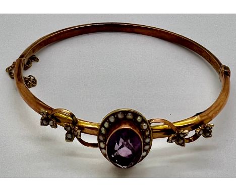 Edwardian 9ct gold bangle with amethyst and seed pearls. 7gm.Condition ReportSplit to gold.
