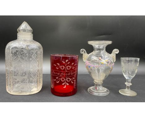 Five glass items to include an etched jar with screw stopper 18cm h, red christening beaker 'For a good Girl', a painted glas