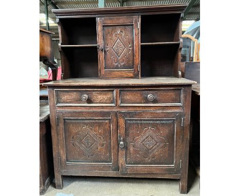 An oak dresser, 2 drawers over 2 doors to base. Single door cupboard and shelves to top. 114 w x 48 d x 135cm h.Condition Rep