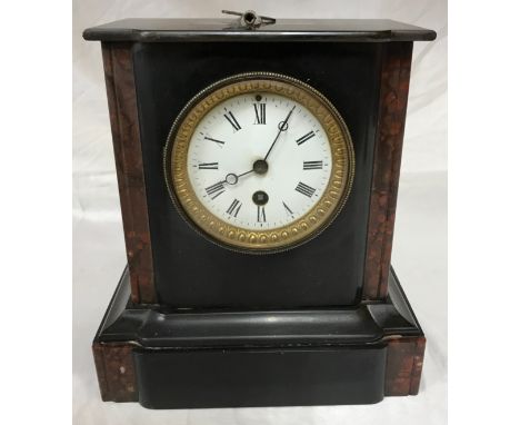 Stone mantel clock with roman numerals 24.5cms h, 23cms w, max depth 13cms.Condition ReportHas key but not tested. Crack to r