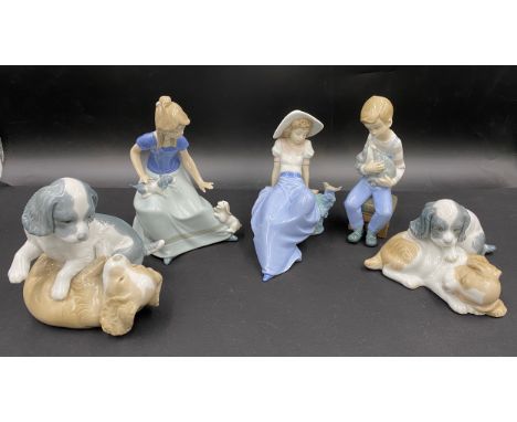 Five various Lladro Nao figurines. Tallest seated girl with 2 puppies 18cm h.Condition ReportAll in good condition.