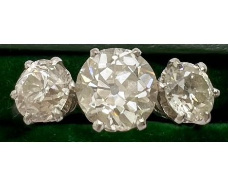 A 3 stone diamond ring set in 18ct white gold, centre stone 1.4ct. 2.84ct in total. 4.5gm total. Size R.Condition ReportGood 