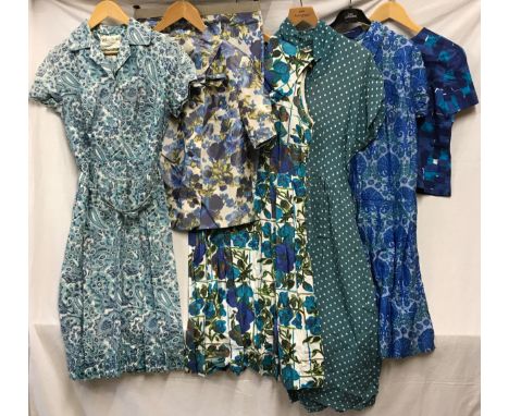 A selection of vintage clothing to include a blue cotton print top, pinafore style blue dress, linen Pokka dot teal dress, a 