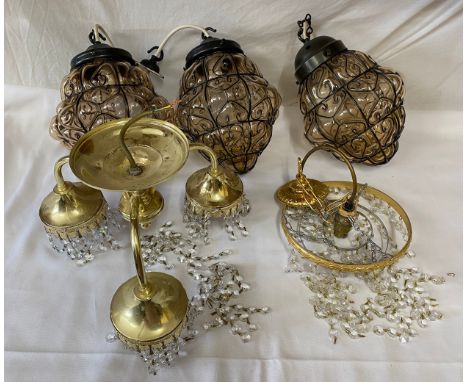 A set of 3 x 20thC coloured glass and black metal light fittings together with 2 x crystal and brass ceiling fittings, one 3 