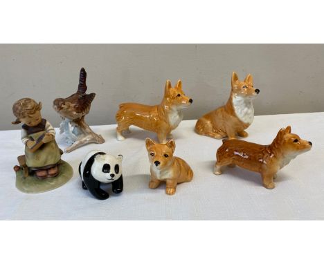 Various ceramics to include; 2 x Goebel, figurine of girl and bird; Beswick panda and 4 x dogs, 2 marked Sylvac.Condition Rep