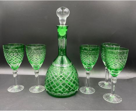 A 20thC green and clear cut glass set comprising a decanter 35cm h and 5 x wine glasses 20cm h.Condition ReportNo chips or cr