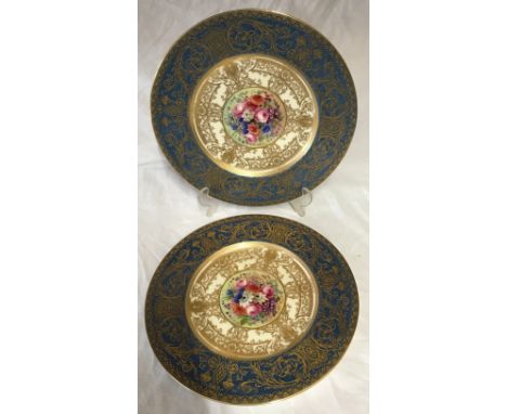 Pair of hand painted Royal Worcester plates signed E Phillips, 27cm d. Depicting flowers to the centre.Condition ReportGood c