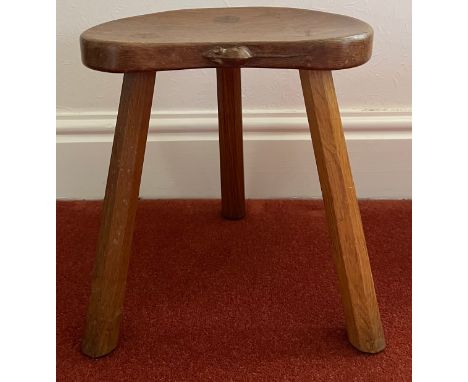 A Robert 'Mouseman' Thompson calf stool, purchased 1977. 35 h x 30cm w.Condition ReportGood condition.