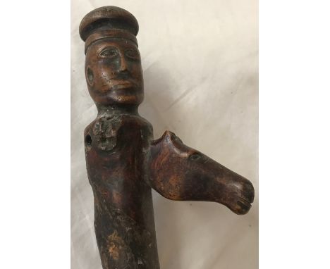 Wooden walking stick with carved gent's head and horse head handle, 87cms in length.Condition ReportMinor crack to shoulder a