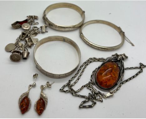 Jewellery to include amber pendant and earrings marked .925, 2 silver hallmarked bangles, 1 unmarked white metal bangle and a