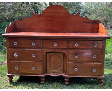 Mahogany dresser on turned legs, drawers and cupboard to centre. 188.5 x 56 d x 153cm to back.Condition ReportCrack to back a