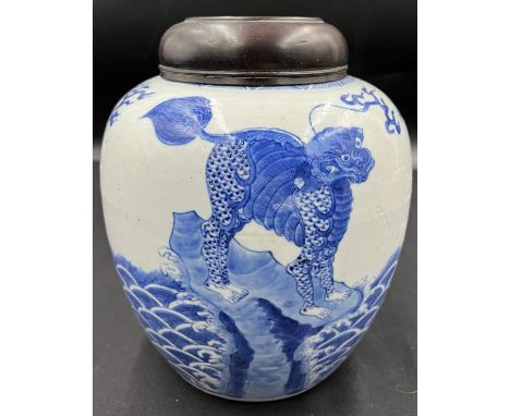 A Chinese porcelain blue and white ginger jar 22cm h with carved hardwood cover, possibly Kangxi.Condition ReportDamage to co