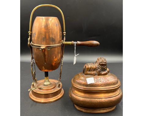 A late 19thC French copper and brass coffee maker together with a 19thC copper tea caddy with recumbent lion to the top.Condi