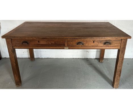 An oak office desk with 2 drawers, makers label for Rymer Thompson?s, Market Place, Hull. 153 w x 91 d x 75cm h.Condition Rep