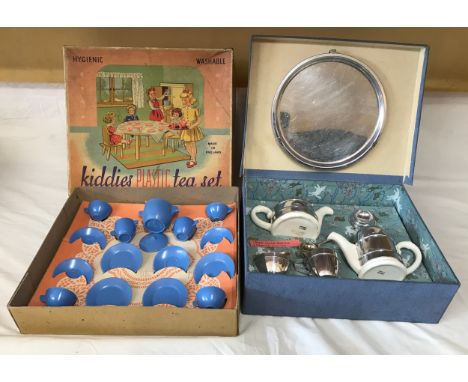 Two boxed children's toy tea sets, one Kavin Kupid Products pottery and chrome 8 piece, and the other plastic Chad Valley 15 