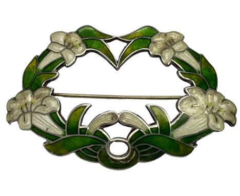 A Sterling silver and enamel Art Nouveau brooch formed by a ring of white trumpet lilies and green leaves, marked to rear Ste