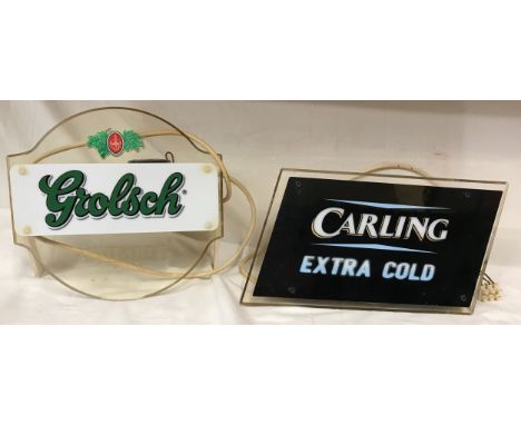 Pub bar light up advertising displays, Grolsch 26 h x 28cm w and Carling Extra Cold 19h x 35cm w.Condition ReportWorking when