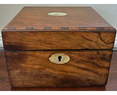 Mahogany tea caddy with mother of pearl to top, escutcheon and inlay to top edges. inner lift to reveal plated caddy spoon. 1