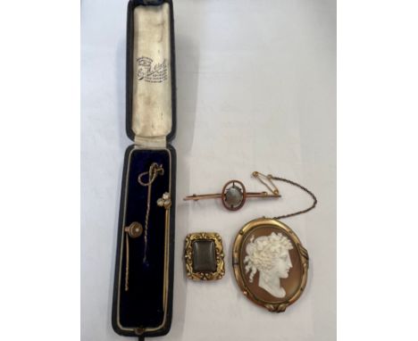 Jewellery to include 3 stick pins, bar brooch with pearl, shell cameo brooch and mourning brooch, lacking pin. John B Boyes.C