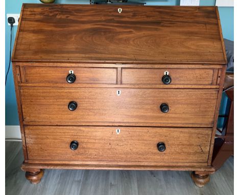 A 19thC mahogany bureau with replacement knobs and ivory escutcheon and fitted interiors.  119 w x 55 d x 714cm h.Condition R