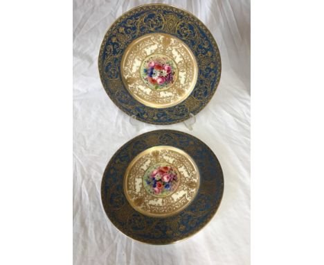 Pair of hand painted Royal Worcester plates signed E Phillips, 27cm d. Depicting flowers to the centre.Condition ReportGood c