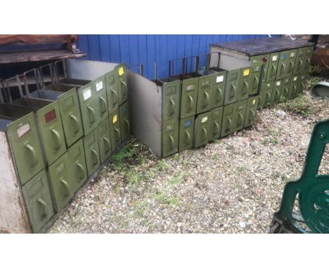 Three industrial steel multi drawer storage cabinets. 14 drawers each, one with steel top. 108 w x 57 d x 65cm h.Condition Re