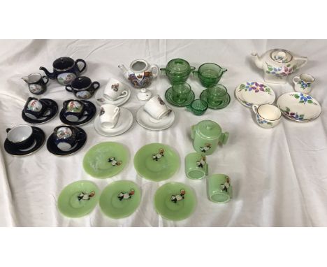 Five assorted children's part tea sets, enameled tinplate blue set, 11 pieces, King George V commemorative 7 pieces, green gl