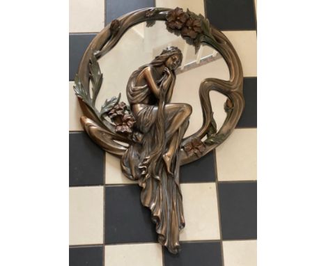 A 'Veronese' Art Nouveau style mirror of a seated lady and flowers. 70 x 46cm at widest  point.Condition ReportGood condition