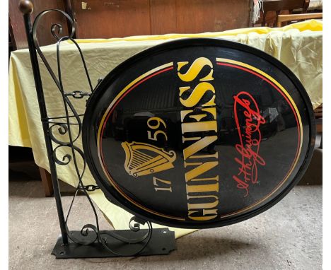 A large plastic Guinness light up wall sign with bracket. Bracket width 88cm.