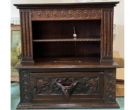 Carved oak cupboard, single door to base, shelf to top section, slot carved to top surface 71cm w x 74cm h x 28cm d.Condition