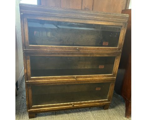 A Globe Wernicke oak 3 height bookcase. 85 w x 24 d x 98cm h.