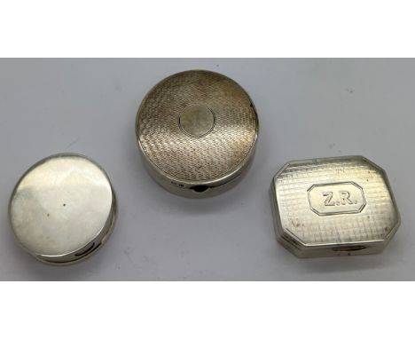 Three silver boxes to include pill box Birmingham 1977 3cm d, maker Charles S Green &amp; Co Ltd, circular box with engine tu