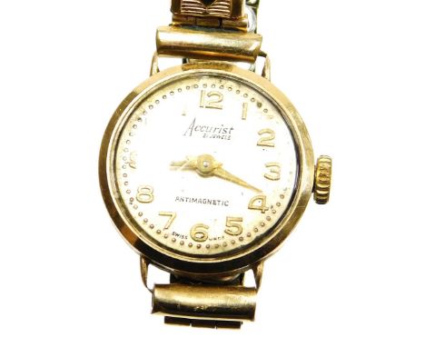 An Accurist ladies wristwatch, in a 9ct gold watch head, on an expanding gold plated strap, in a F H Weaks and Son Jewellers 