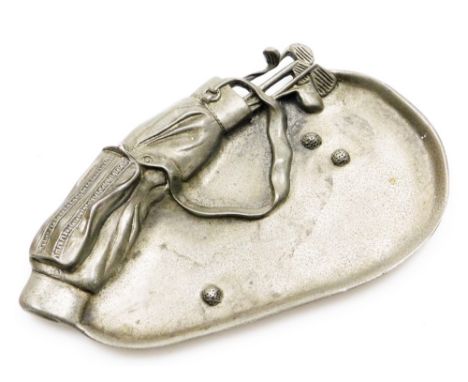 A golfing interest pewter ash or pin tray, cast with golf clubs in caddy bag, and three balls in a bunker, 16cm x 9cm.
