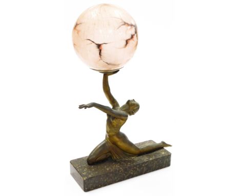 An Art Deco table lamp, in the form of a bronzed patination spelter figure of a kneeling female, on a rounded rectangular mar