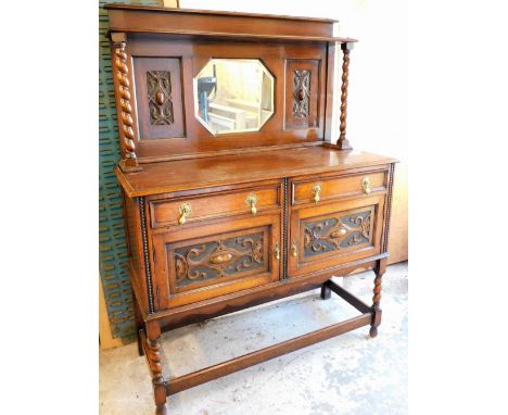 An Art Nouveau oak mirror back sideboard, with carved Art Nouveau detailing and barley twist columns with single shelf above 